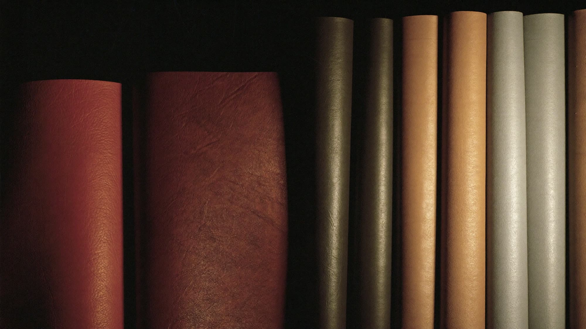 Artificial Leather: rolls of PU and PVC synthetic leather in oxblood, tan and black