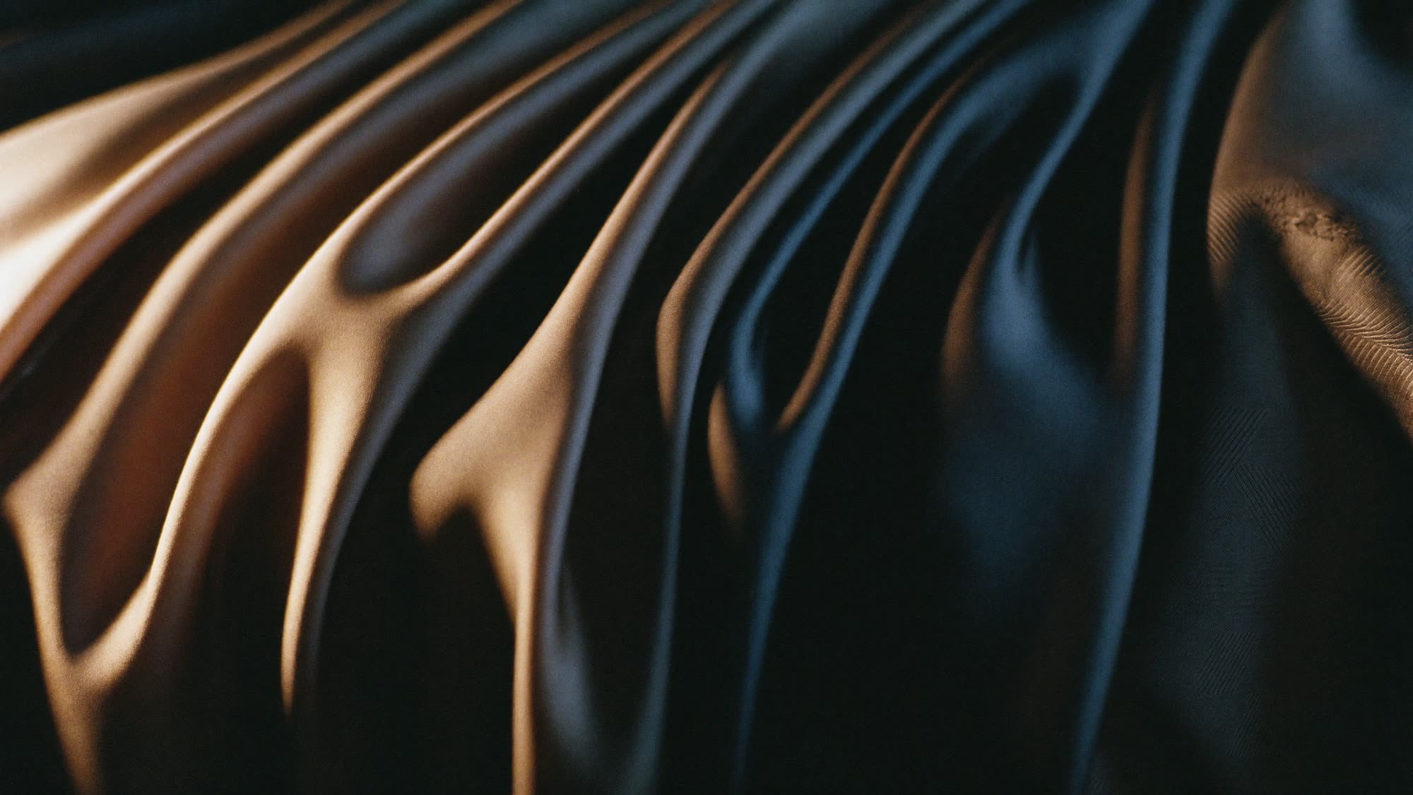 Lining: draped taffeta and jacquard lining fabric catching the light